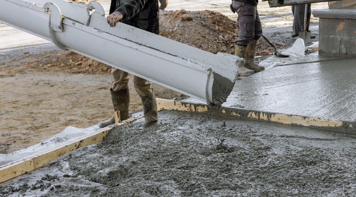 Concrete floor installation with pump chute pouring fresh concrete in Cupertino, CA